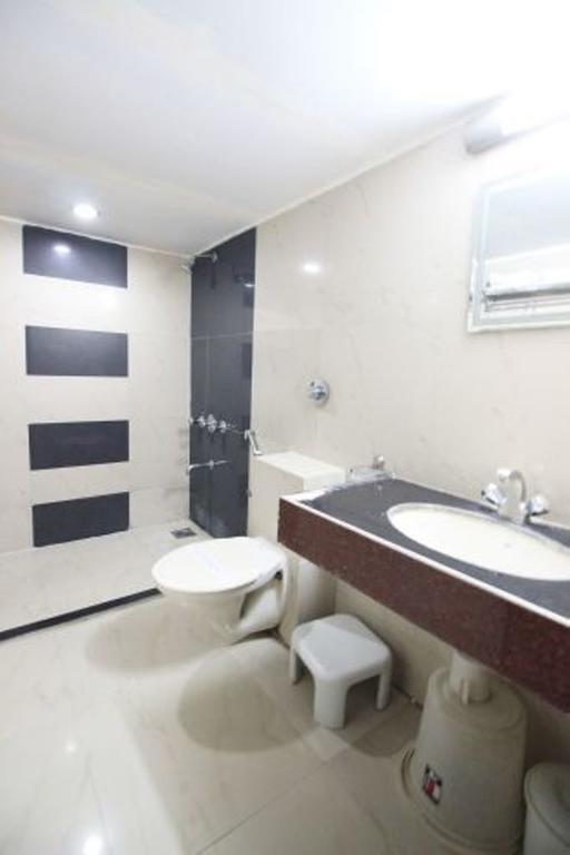 Hotel Eden Amhedabad Oda fotoğraf